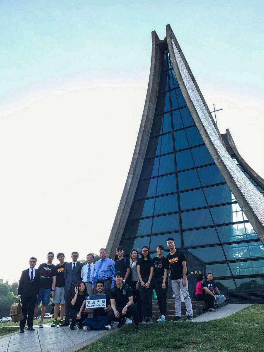 Ambassador King-Sing Tiong, the visiting guests, and Malaysian students in front of the Luce Chapel