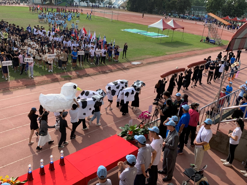 Fine Arts Dept student walks around the sports field